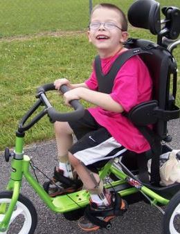 Boy on bike for disabled