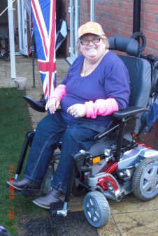 Woman in powered wheelchair